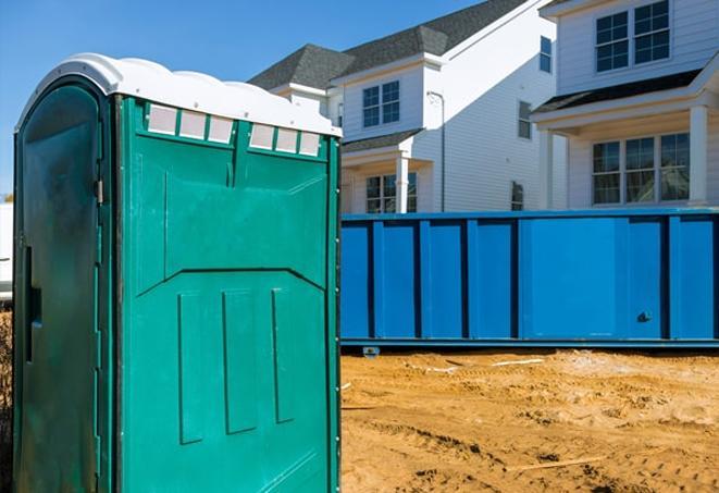 workers at a job site take advantage of convenient portable toilets